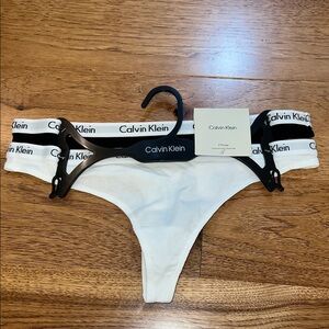 Calvin Klein nwt thongs medium. Black and white. CK label on band